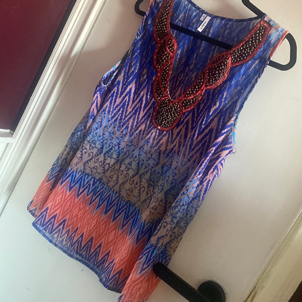 Studio Y semi sheer blouse with key hole detail on back
